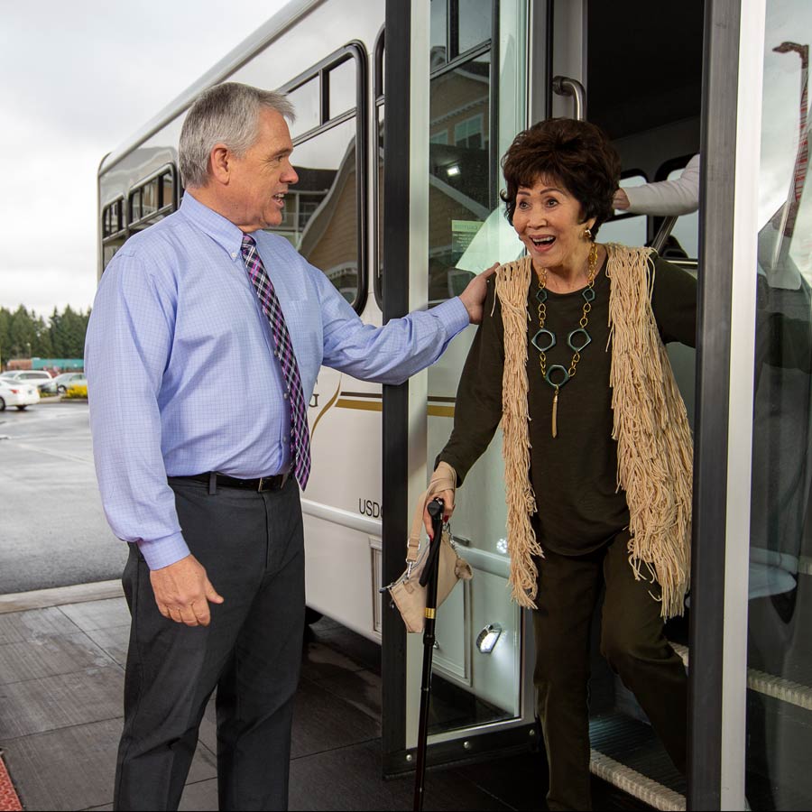 The Carriage House helping lady off bus